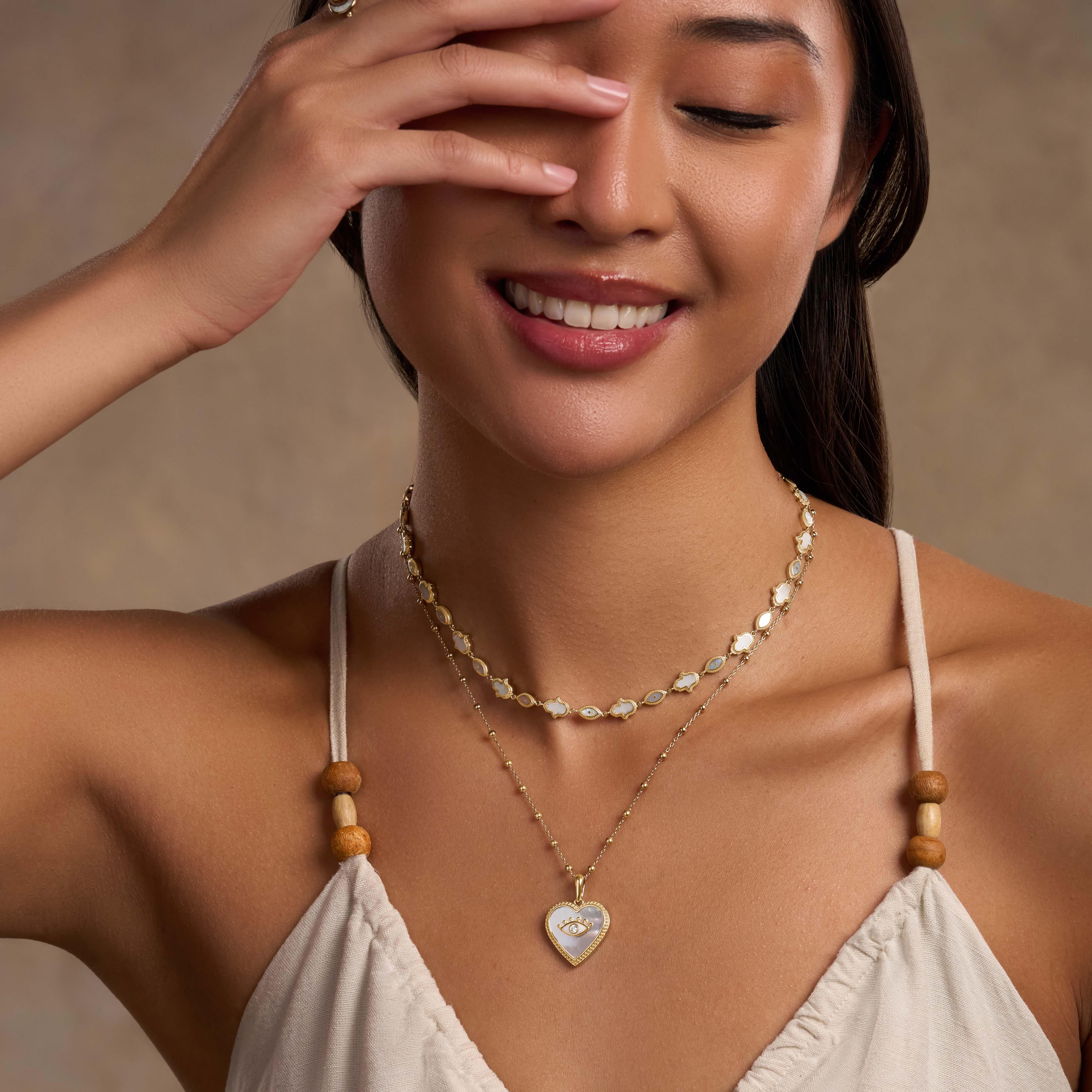 Nurturing Energy White Mother of Pearl Heart & Evil Eye Gold Necklace - Image 2